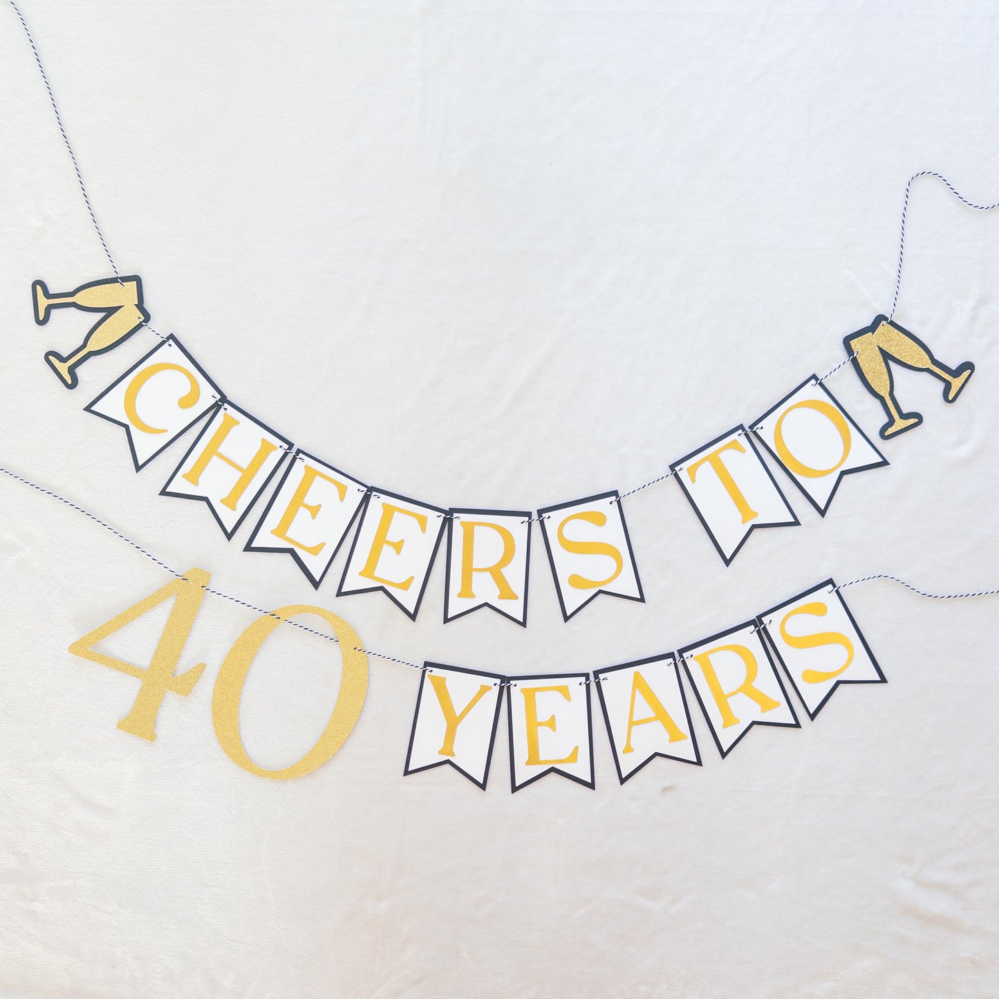 Decorative banner with 'Cheers to 40 Years' text