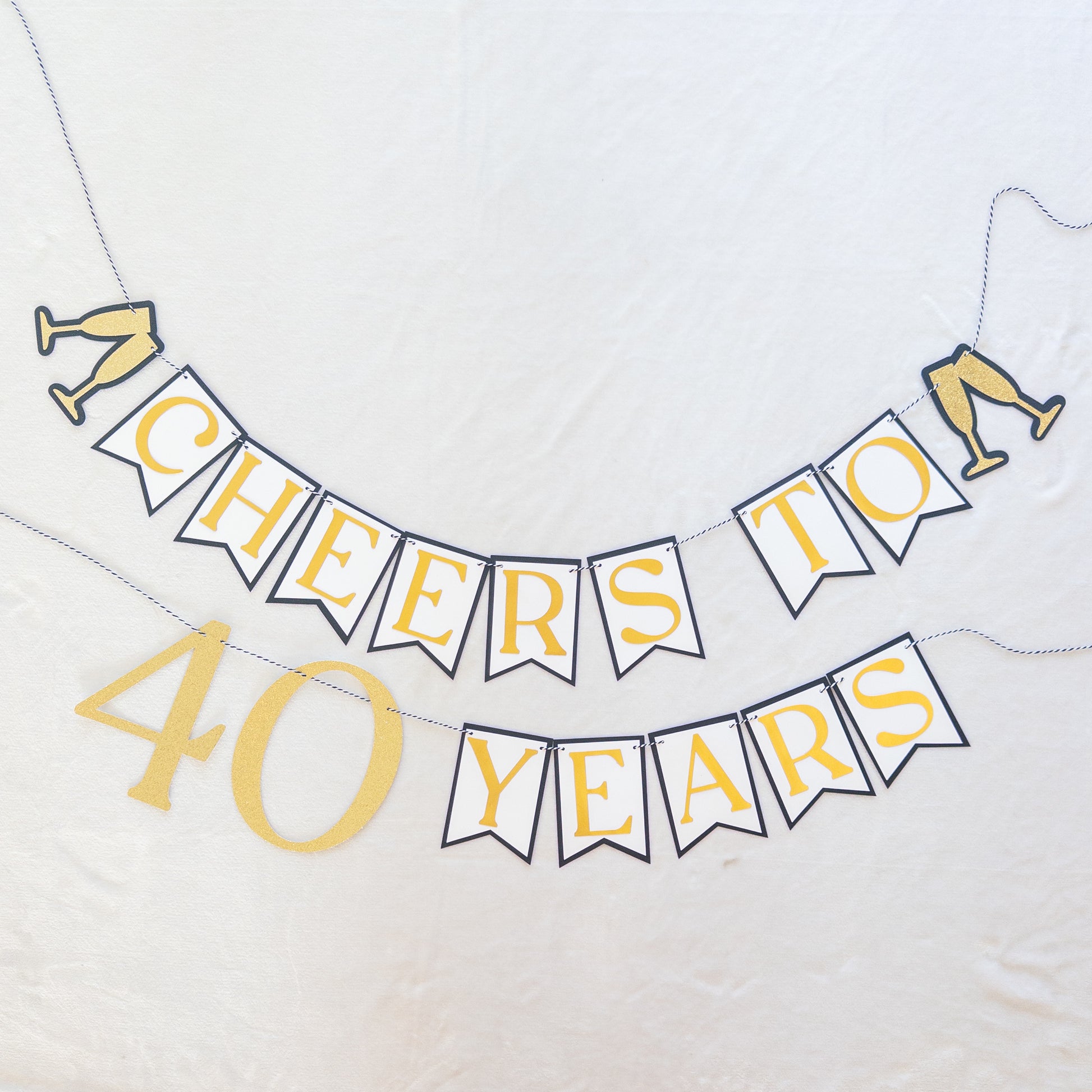 Decorative banner with 'Cheers to 40 Years' text